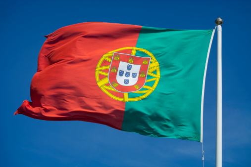 The flag of Portugal waving in the wind.