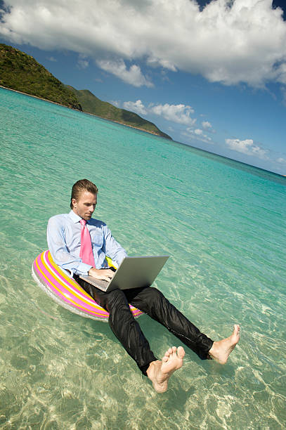 istock Businessman Puts his Toes Up Floating on Ring 173947564