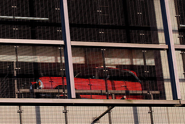 istock Classic red car in modern parking garage. 173947910