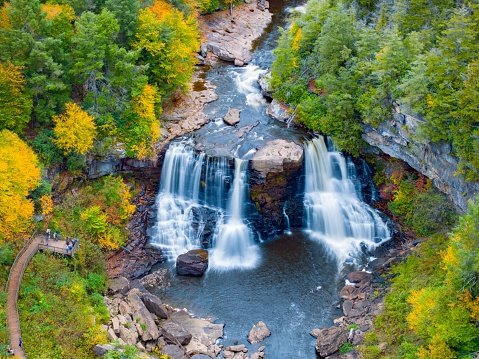 An aerial view of the scenic Blackwater Falls in West Virginia surrounded by fall foliage