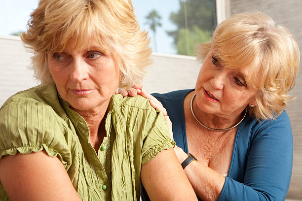 istock And elderly woman consoling her grieving friend 173948147