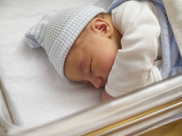 istock Baby Boy In Crib 173948387