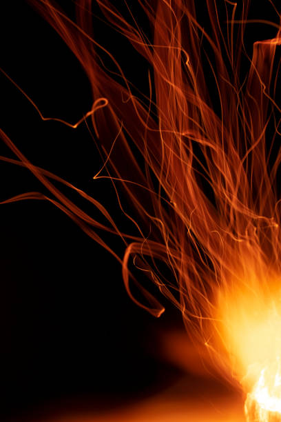 istock light ribbons of sparks on a black background, long exposure 1739484884