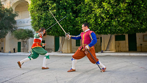 istock Two Maltese Soldiers Sword Fighting 173948754