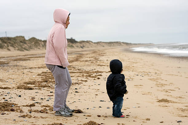istock Mother and son at the seaside in winter 173948894