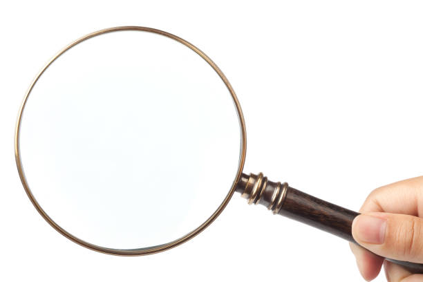 istock isolated magnifying glass in hand 173948994