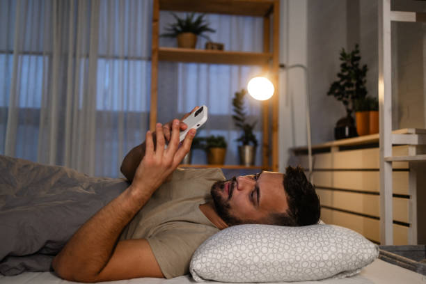 istock Portrait of a man using his phone before sleep 1739494415