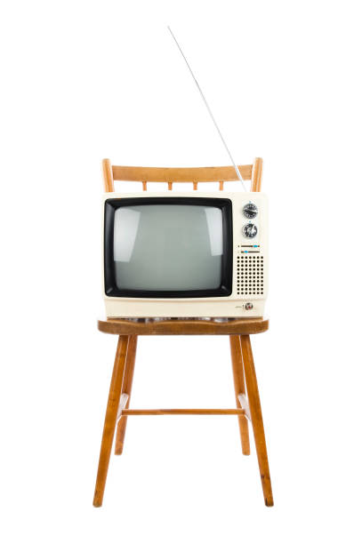 old tv on chair. studio shot.