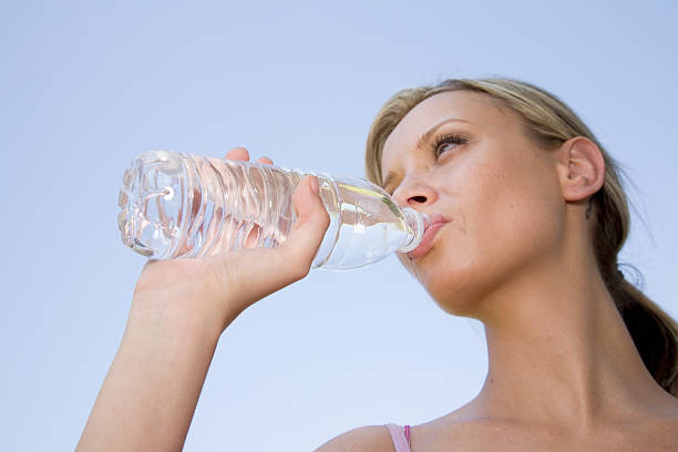 istock Attractive Female Drinking from a Water Bottle 173950157