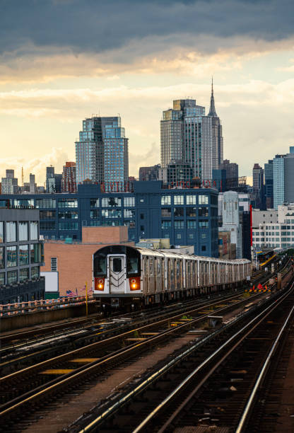istock Train approaching elevated subway station in Queens, New York 1739529220