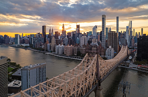 Sunset over the Midtown Manhattan skyline over Queensboro Bridge with the view of Midtown Manhattan