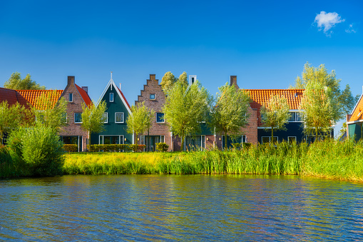 A row of houses in the Volendam, Netherlands. Old buildings. Architecture and construction. Photo for background and wallpaper.