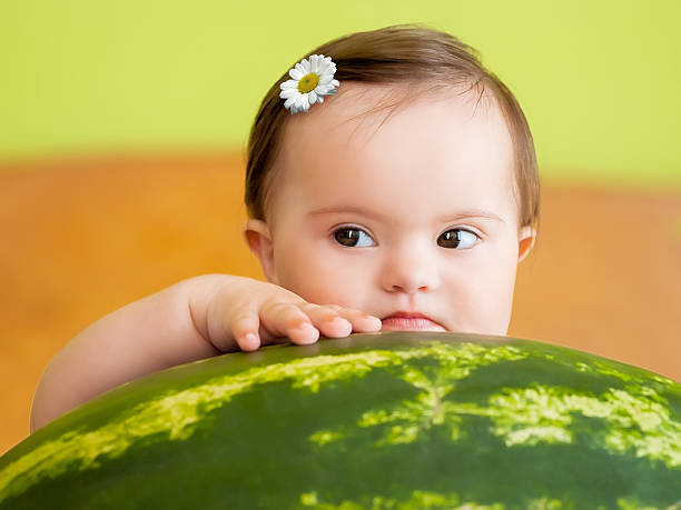Pretty baby girl with big watermelon stock photo