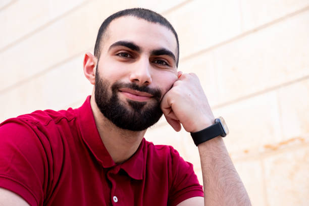 istock Portrait for man sitting on stairs while smiling 1739532051