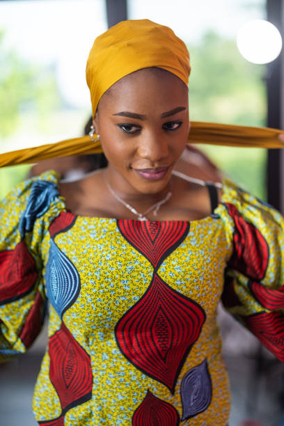 istock Woman putting on a headscarf 1739532592
