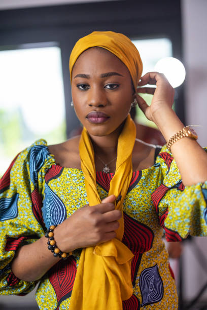 istock Woman putting on a headscarf 1739533148