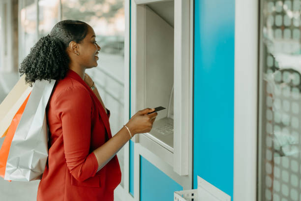 secure financial transaction - atm human hand bank real people imagens e fotografias de stock