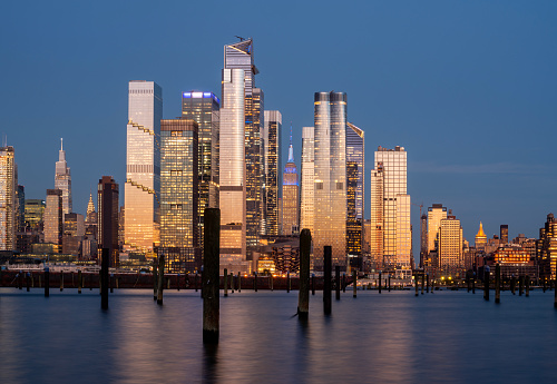 New York City financial district over Hudson River at dusk