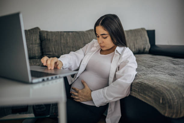 istock Young beautiful pregnant woman having a difficult conversation on video call 1739584974
