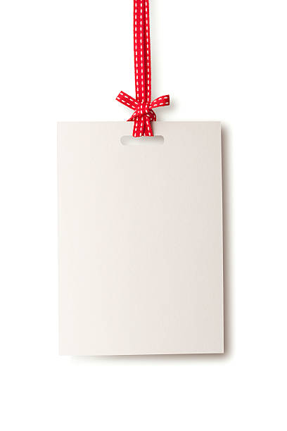 White blank card hanging from red ribbon
