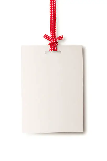 Photo of White blank card hanging from red ribbon