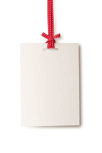 white blank card hanging from red ribbon - christmas tags bildbanksfoton och bilder