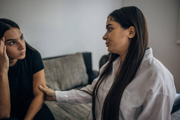 istock Two young beautiful women are having a difficult conversation 1739590912