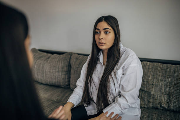 istock Two young beautiful women are having a difficult conversation 1739596756