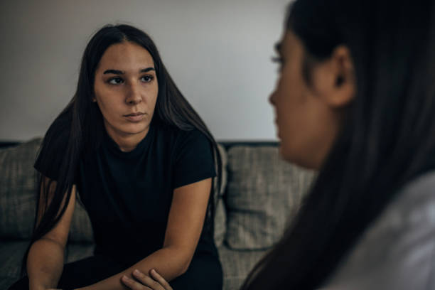 istock Two young beautiful women are having a difficult conversation 1739597414