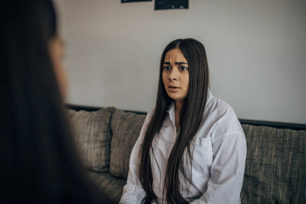 istock Two young beautiful women are having a difficult conversation 1739599021