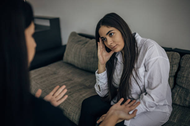 istock Two young beautiful women are having a difficult conversation 1739602815