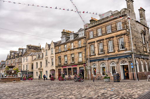 St Andrews, Scotland - September 22, 2023: Historic golf shops, restaurants and hotels along the streets of St Andrews Scotland by the Old Course