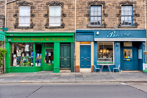 St Andrews, Scotland - September 22, 2023: Historic golf shops, restaurants and hotels along the streets of St Andrews Scotland by the Old Course