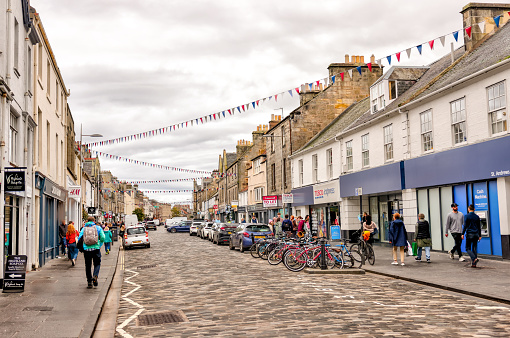 St Andrews, Scotland - September 22, 2023: Historic golf shops, restaurants and hotels along the streets of St Andrews Scotland by the Old Course