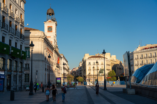 Málaga, Spain, June 13, 2022; Main square (Plaza de la Constitucion) in the city of Malaga with the tower of the cathedral in the background.