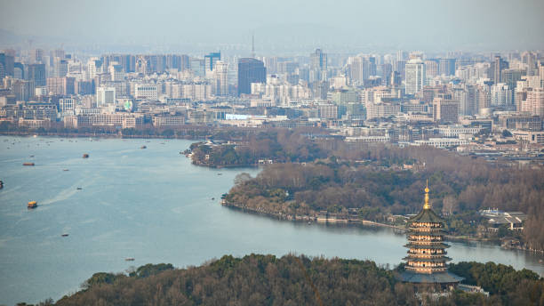 hangzhou city, zhejiang province - aerial photography of west lake, leifeng pagoda and city skyline - moscow river stock-fotos und bilder
