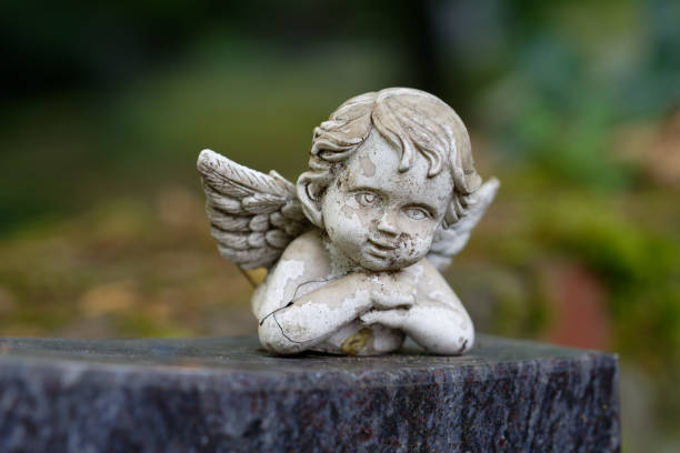 istock weathered putto figure with wings 1739635043