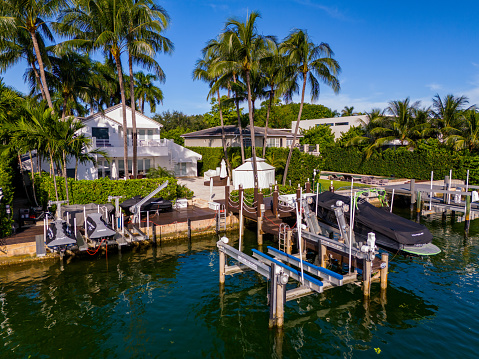 Miami Beach, FL, USA - October 6, 2023:  Aerial drone photo of a luxury waterfront mansion home on Allison Island Miami Beach Florida