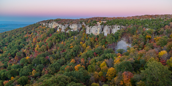 Fall colors on Cameron Bluff, Mount Magazine, Arkansas. The Earth’s shadow can be seen in the background as a blue band at the horizon.