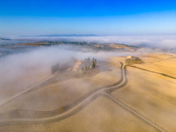 Foggy landscape in Val d'Orcia from drone
