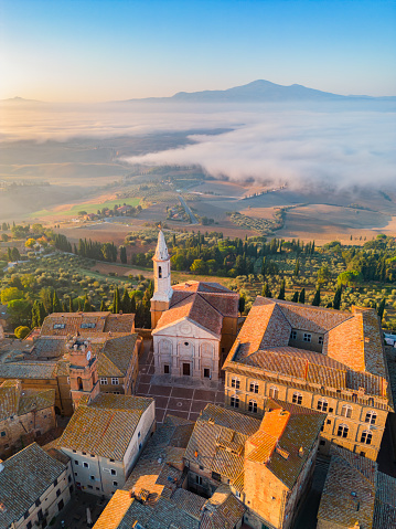 Pienza Tuscan town from dorne with fog, Val d'Orcia at dawn