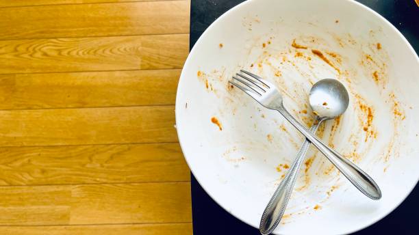 istock Top view of empty plate, dirty after the meal is finished isolate with clipping path and copy space for text on right area, sauce smeared on a plate. 1739697008