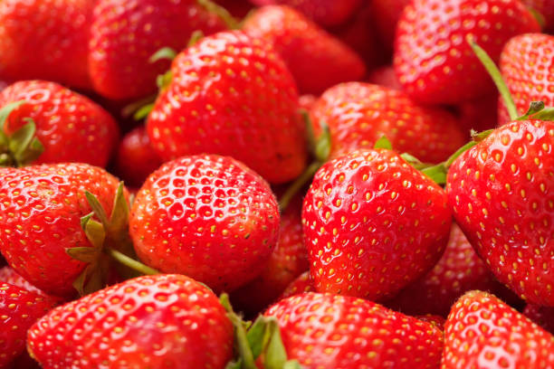 istock Fresh organic red strawberry fruit background 1739697906