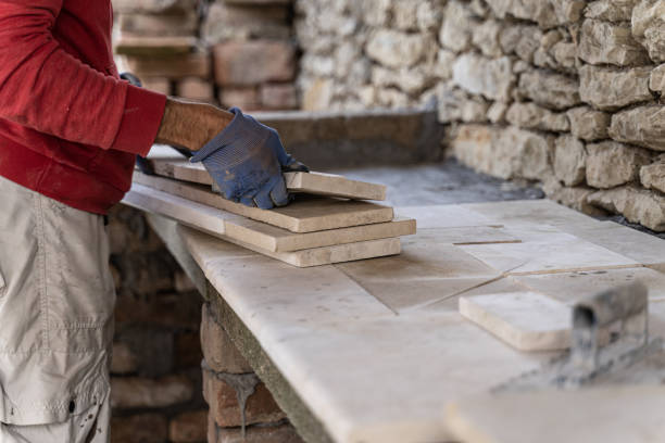 istock DIY home improvement. Man building stone barbeque. 1739697962