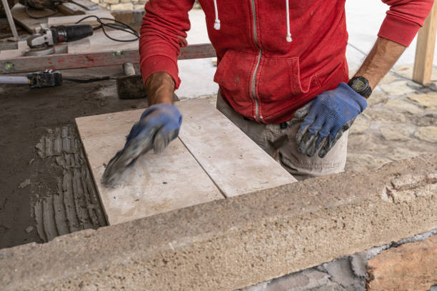 istock DIY home improvement. Man building stone barbeque. 1739698001