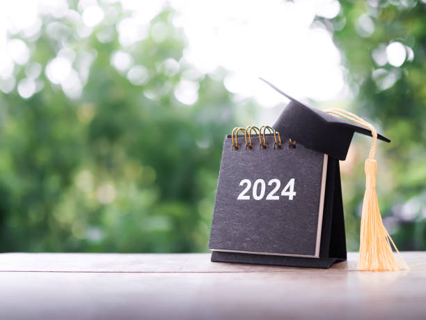 istock Study goals, 2024 Desk calendar with graduation hat. The concept for Resolution, Goal, Action, Planning, and manage time to success graduate. 1739706933