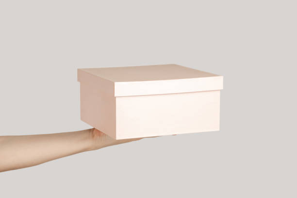 istock Woman hand showing present box, gift for holiday, event, celebration. 1739709071