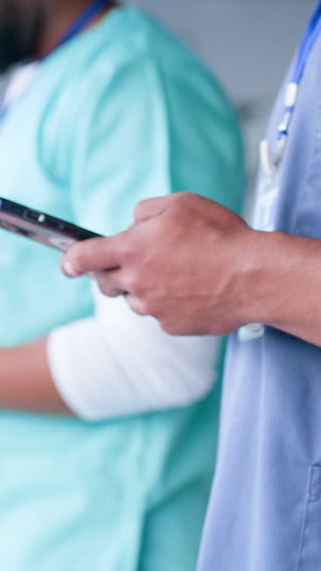 Phone, line and hands of doctors search on social media, internet and online together in a hospital for research. Medical, mobile app and closeup of healthcare team typing on smartphone networking