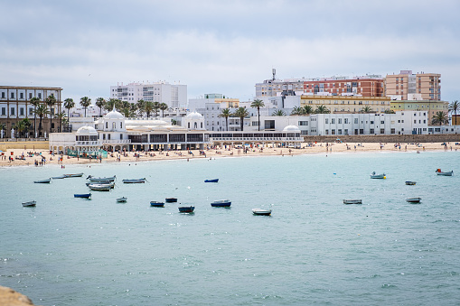 Cádiz, Spain - April 30, 2023: La Caleta Beach is a small but famous beach near the center of Cadiz. It was the filming site of scenes in the James Bond film \