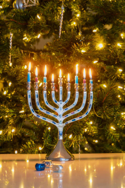 istock On a blurred background Hanukkah menorah with candles sits on table 1739877954